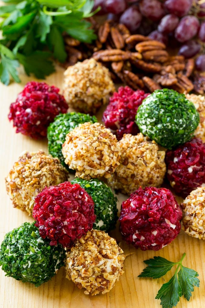 Cheese Ball Bites Recipe | Holiday Cheese Ball Recipe | Pecan Cheese Ball | Cranberry Cheese Ball | Mini Cheese Balls #cheeseball #cheese #appetizer #ezlod Cheese ball bites rolled in assorted toppings and served with fruit and nuts.
