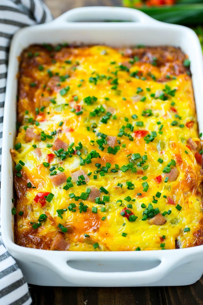 Hash Brown Egg Casserole Recipe | Breakfast Casserole with Ham | Hash Brown Casserole | Ham and Egg Casserole | Egg Casserole with Ham #casserole #breakfast #eggs #egg #hashbrown #ezlod Hash brown casserole with ham, vegetables and cheese in a baking dish,