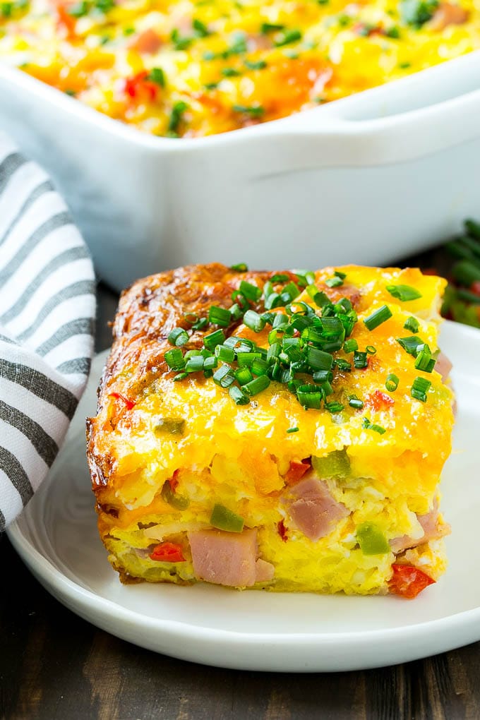 Hash Brown Egg Casserole Recipe | Breakfast Casserole with Ham | Hash Brown Casserole | Ham and Egg Casserole | Egg Casserole with Ham #casserole #breakfast #eggs #egg #hashbrown #ezlod A cut slice of hash brown casserole.