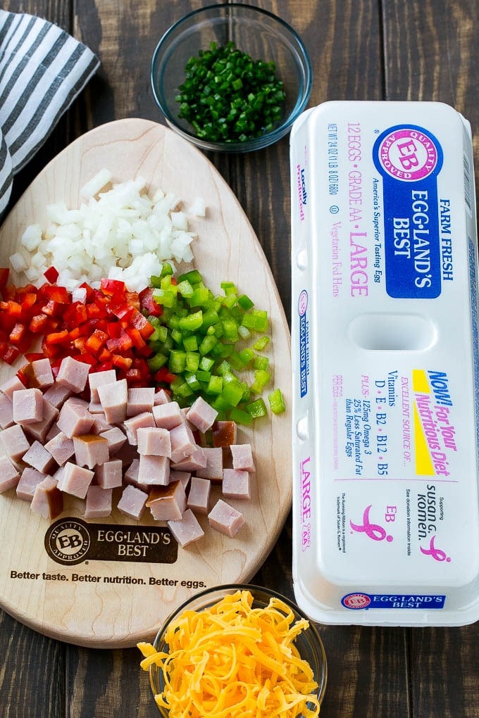 Hash Brown Egg Casserole Recipe | Breakfast Casserole with Ham | Hash Brown Casserole | Ham and Egg Casserole | Egg Casserole with Ham #casserole #breakfast #eggs #egg #hashbrown #ezlod Ingredients including eggs, ham, peppers, onions and cheese.