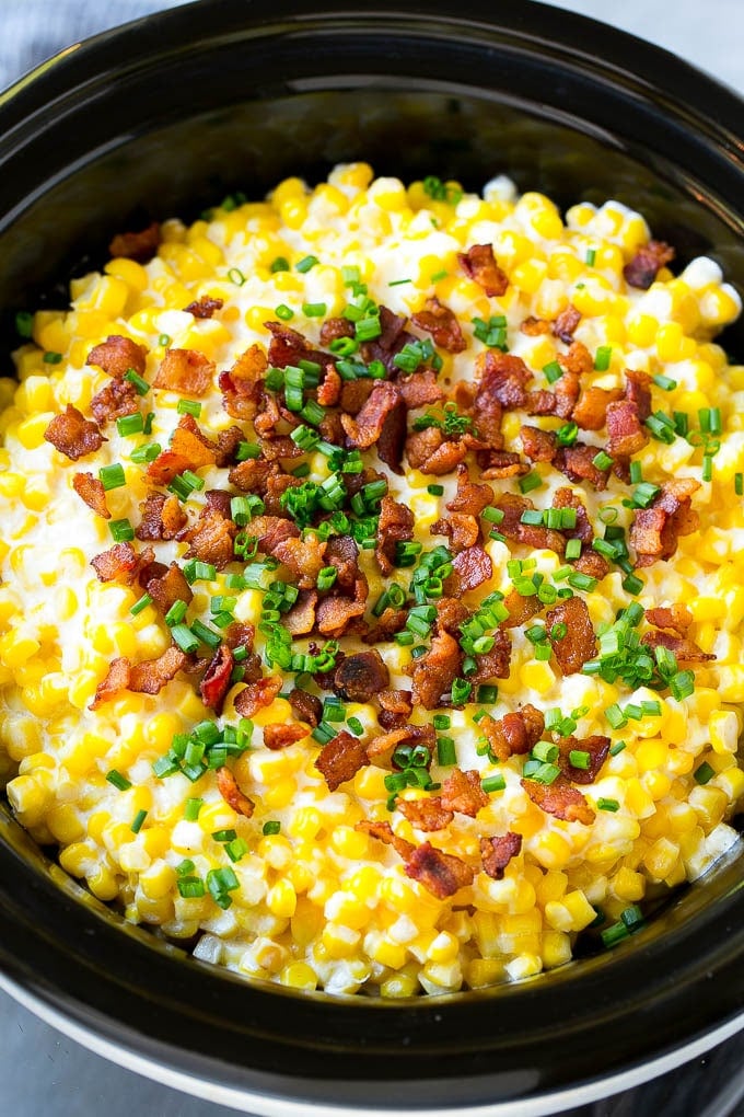 Slow Cooker Creamed Corn Recipe | Easy Creamed Corn Recipe | Slow Cooker Creamed Corn with Bacon | Southern Creamed Corn | Creamed Corn with Cream Cheese #creamedcorn #corn #bacon #crockpot #slowcooker #dinner #ezlod Slow cooker creamed corn topped with bacon and chives.
