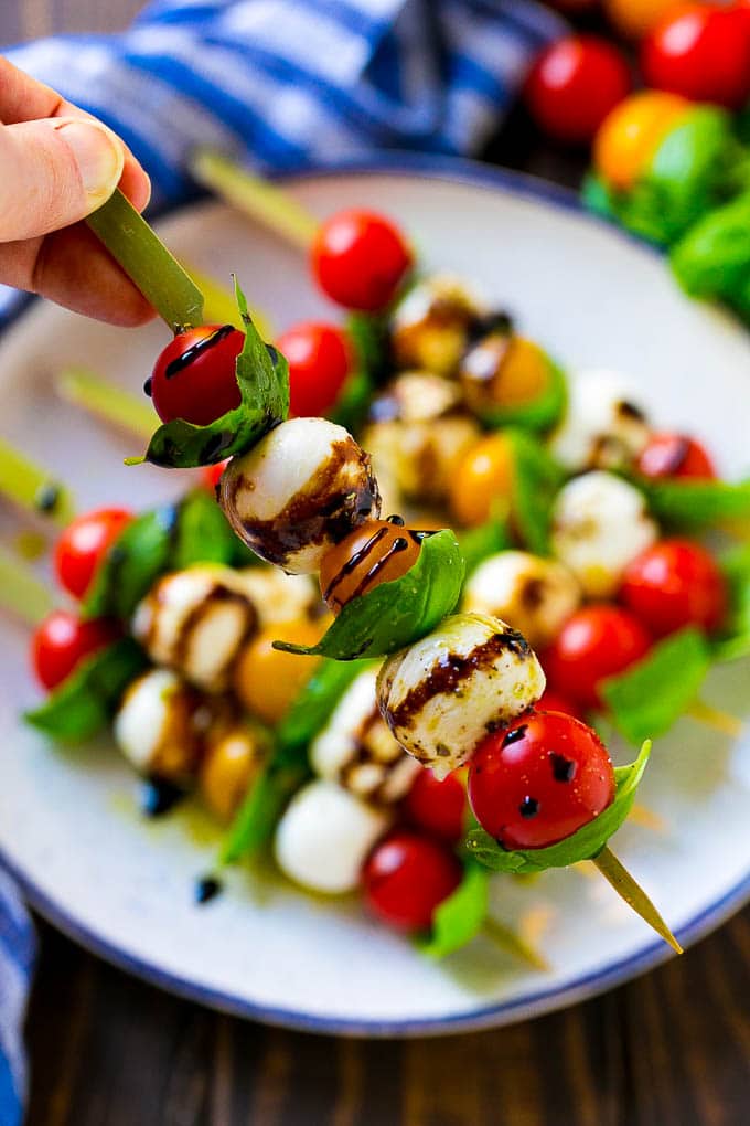 Caprese Skewers | Caprese Kabobs | Caprese Appetizer #tomato #mozzarella #basil #caprese #appetizer #ezlod A kabob of mozzarella, tomatoes and basil drizzled with balsamic glaze.