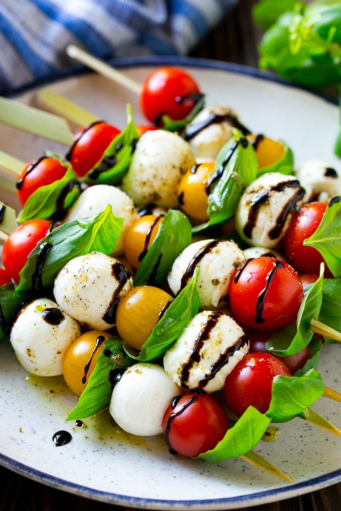 Caprese Skewers | Caprese Kabobs | Caprese Appetizer #tomato #mozzarella #basil #caprese #appetizer #ezlod Caprese skewers with mozzarella, cherry tomatoes and basil with balsamic glaze.