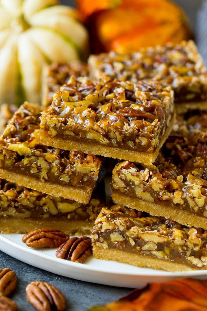 Pecan Pie Bars Recipe #pecans #pie #fall #pecanpie #dessert #thanksgiving #ezlod A serving platter full of pecan pie bars.