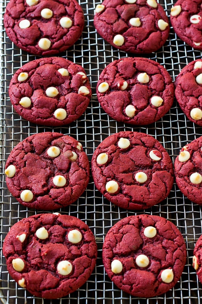 Red Velvet Cookies Recipe | Red Velvet Cookies with White Chocolate Chips | Red Velvet Cake Mix Cookies #redvelvet #cookies #whitechocolate #christmas #ezlod Baked cookies on a wire cooling rack.