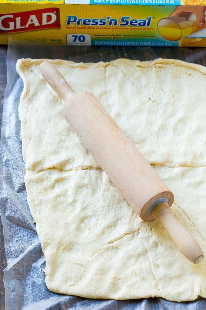 Veggie Pizza Recipe | Crescent Veggie Pizza | Vegetable Pizza Recipe | Holiday Appetizer | Homemade Veggie Pizza #pizza #veggies #vegetarian #appetizer #ezlod Crescent roll dough rolled out into a rectangle.