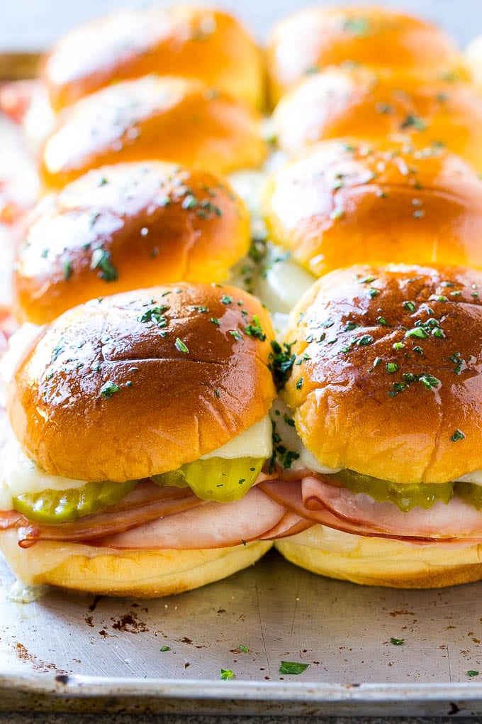 Cuban Sliders Recipe | Cuban Sandwich Recipe | Slider Sandwiches | Ham and Cheese Sliders #sliders #sandwiches #ham #cheese #appetizer #ezlod A sheet pan of Cuban slider sandwiches.