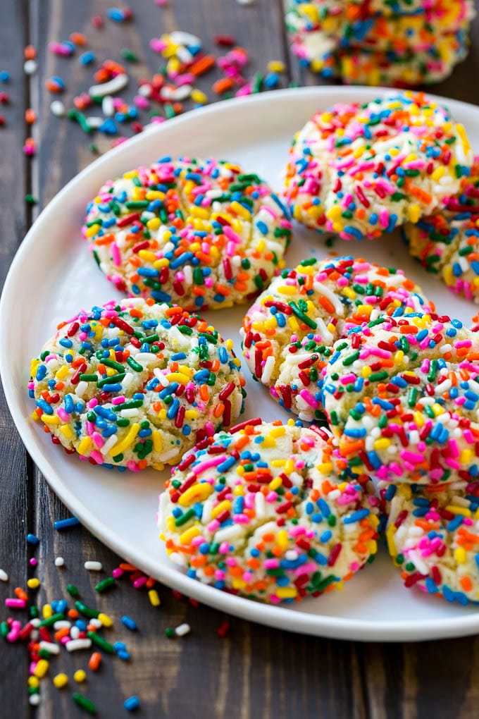Funfetti Cookies Recipe | Funfetti Cake Mix Cookies | Sprinkle Cookies | Cake Mix Cookies #cookies #funfetti #sprinkles #dessert #ezlod A plate of funfetti cookies coverd in rainbow sprinkles.