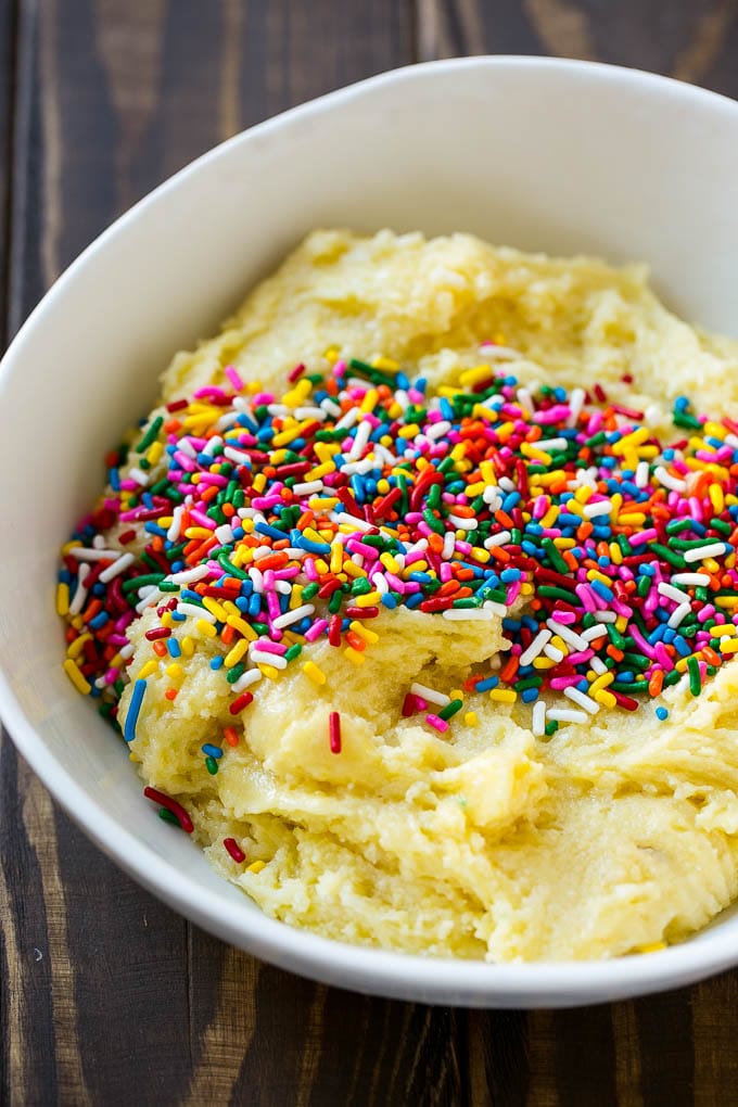 Funfetti Cookies Recipe | Funfetti Cake Mix Cookies | Sprinkle Cookies | Cake Mix Cookies #cookies #funfetti #sprinkles #dessert #ezlod Cookie dough in a bowl with sprinkles on top.