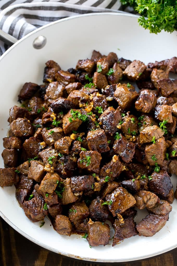 Steak Bites in Garlic Butter Recipe | Garlic Steak | Sirloin Steak Recipe | Steak Appetizer #steak #lowcarb #keto #ezlod #dinner A frying pan of beef cubes tossed in garlic butter.