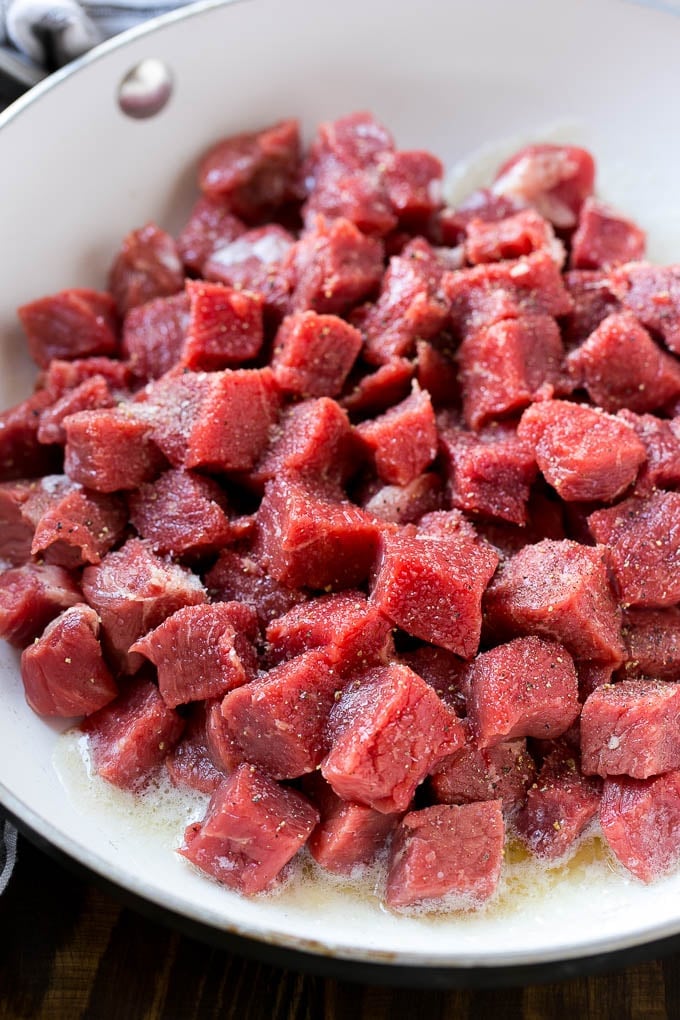 Steak Bites in Garlic Butter Recipe | Garlic Steak | Sirloin Steak Recipe | Steak Appetizer #steak #lowcarb #keto #ezlod #dinner Cubes of raw beef seasoned with salt and black pepper.