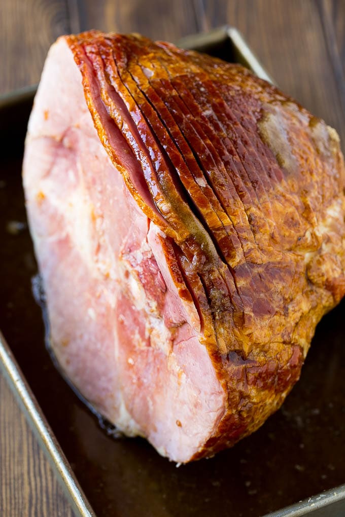 Coca Cola Ham | Coke Glazed Ham | Easter Ham | Christmas Ham | Holiday Ham Recipe #ham #easter #christmas #dinner #ezlod An uncooked spiral ham topped with coke and brown sugar.