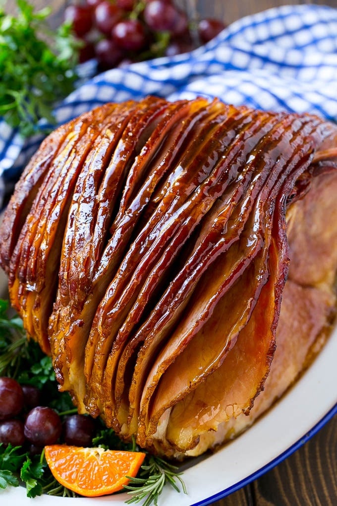 Coca Cola Ham | Coke Glazed Ham | Easter Ham | Christmas Ham | Holiday Ham Recipe #ham #easter #christmas #dinner #ezlod A whole spiral cut coca cola ham on a platter.