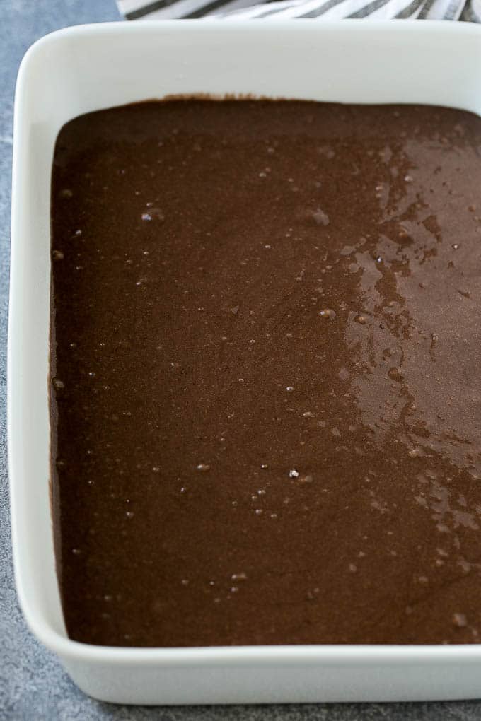 Earthquake Cake Recipe | Chocolate Cake Recipe | Chocolate Coconut Cake | Coconut Pecan Cake #cake #chocolate #coconut #pecans #dessert #chocolatecake #ezlod Chocolate cake batter in a baking dish.