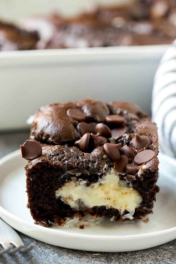 Earthquake Cake Recipe | Chocolate Cake Recipe | Chocolate Coconut Cake | Coconut Pecan Cake #cake #chocolate #coconut #pecans #dessert #chocolatecake #ezlod A slice of earthquake cake on a plate.