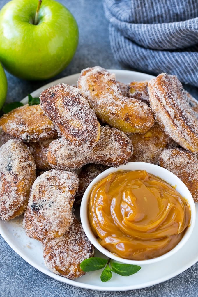 Apple Fries Recipe | Fried Apples Recipe | Cinnamon Sugar Apples | Apple Dessert Recipe #apples #dessert #ezlod #fall A pile of cinnamon sugar apple fries with caramel sauce for dipping.