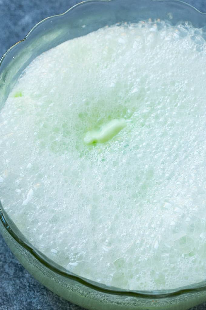 Lime Sherbet Punch | Party Punch Recipe | Sherbet Punch Recipe | Limeade Recipe #sherbet #punch #lime #drink #ezlod Soda that has been poured into a large bowl.