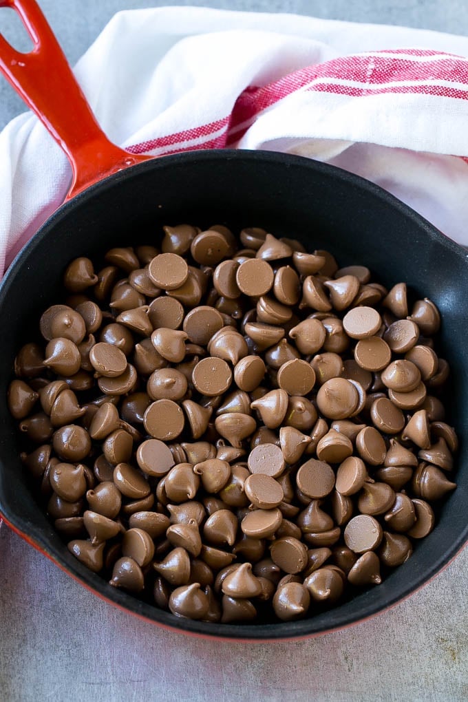 S'mores Dip Recipe | S'mores Skillet | Baked S'mores #smores #dip #chocolate #marshmallow #dessert #ezlod A skillet of milk chocolate chips.