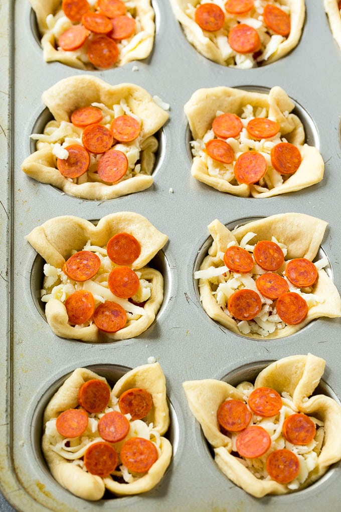 Pizza Muffins Recipe | Pizza Bites | Pizza Cups | Pizza Appetizer #pizza #appetizer #ezlod Unbaked dough cups filled with cheese, sauce and pepperoni.