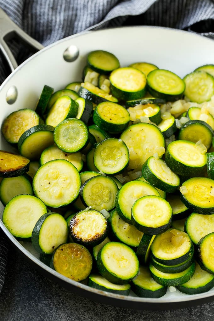 Zucchini Gratin Recipe | Cheesy Zucchini | Baked Zucchini | Easy Zucchini Recipe #zucchini #casserole #cheese #dinner #sidedish #ezlod Sauteed zucchini and onions in a skillet.