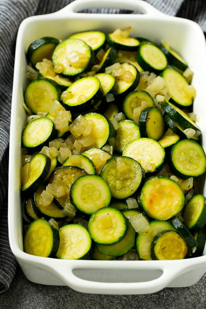 Zucchini Gratin Recipe | Cheesy Zucchini | Baked Zucchini | Easy Zucchini Recipe #zucchini #casserole #cheese #dinner #sidedish #ezlod Sauteed zucchini and onions in a baking dish.