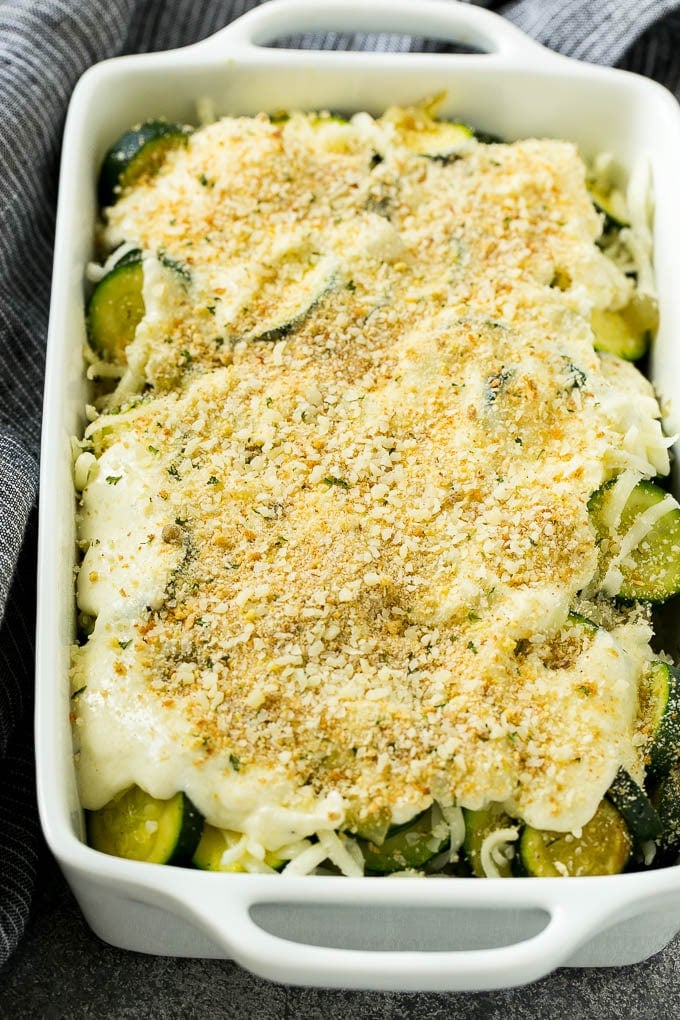 Zucchini Gratin Recipe | Cheesy Zucchini | Baked Zucchini | Easy Zucchini Recipe #zucchini #casserole #cheese #dinner #sidedish #ezlod Zucchini gratin with layers of cheese, sauce and breadcrumbs, ready to go into the oven.