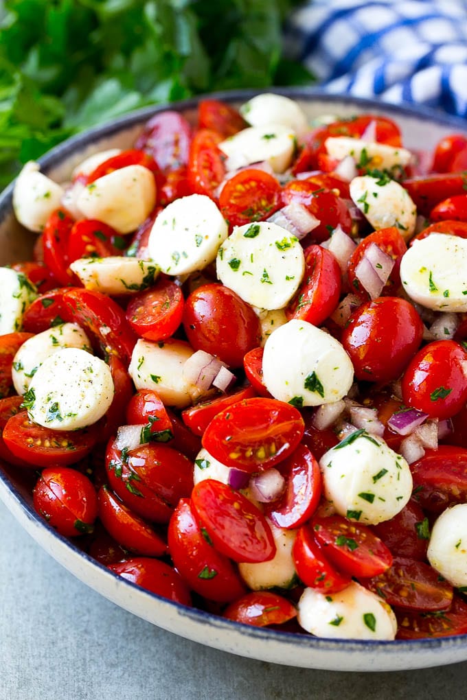 Cherry Tomato Salad Recipe | Tomato Mozzarella Salad | Caprese Salad | Tomato Salad #tomatoes #salad #tomatosalad #caprese #ezlod Cherry tomato salad with halved cherry tomatoes, mozzarella balls and red onion, all tossed with herbs and dressing.