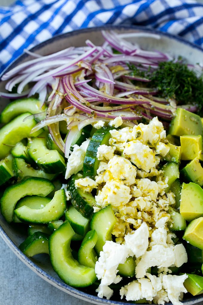 Cucumber Feta Salad Recipe | Cucumber Salad | Feta Cheese Salad | Summer Salad #salad #cucumber #ezlod Veggies and cheese topped with Greek dressing.