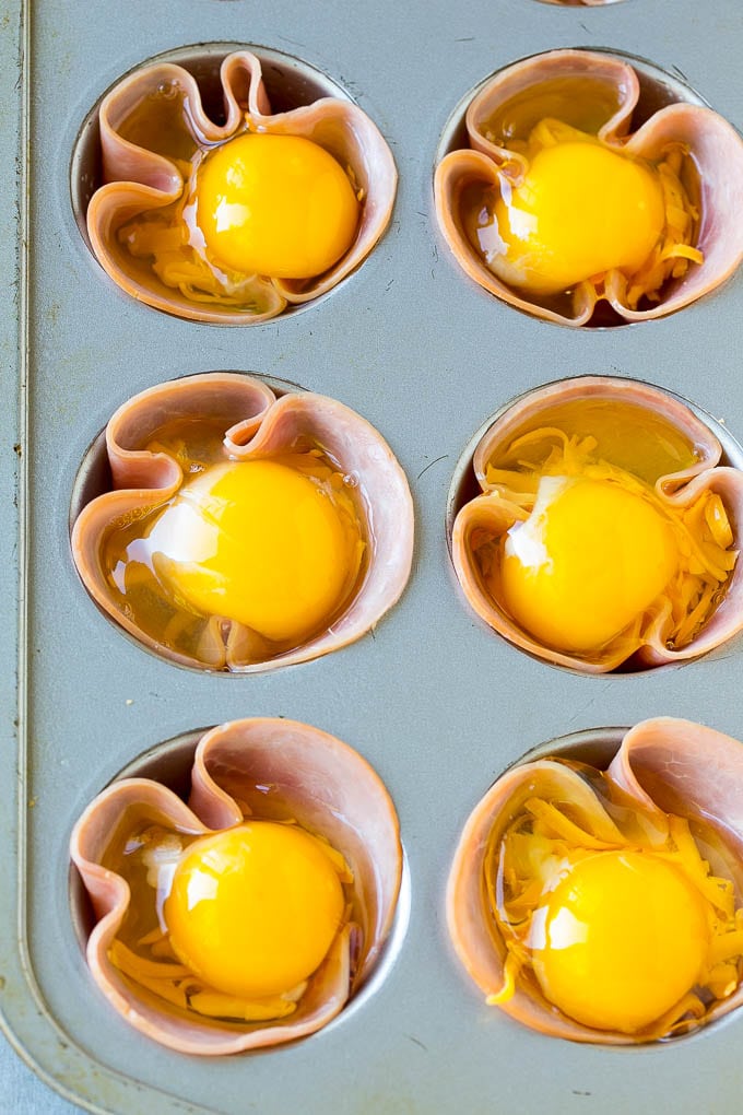 Ham and Egg Cups Recipe | Low Carb Breakfast | Ham and Eggs #ham #eggs #lowcarb #breakfast #ezlod Ham pressed into muffin tins and topped with eggs and cheese.