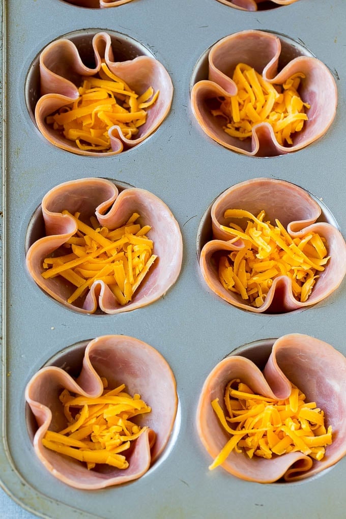 Ham and Egg Cups Recipe | Low Carb Breakfast | Ham and Eggs #ham #eggs #lowcarb #breakfast #ezlod Ham pressed into muffin tins and topped with shredded cheese.