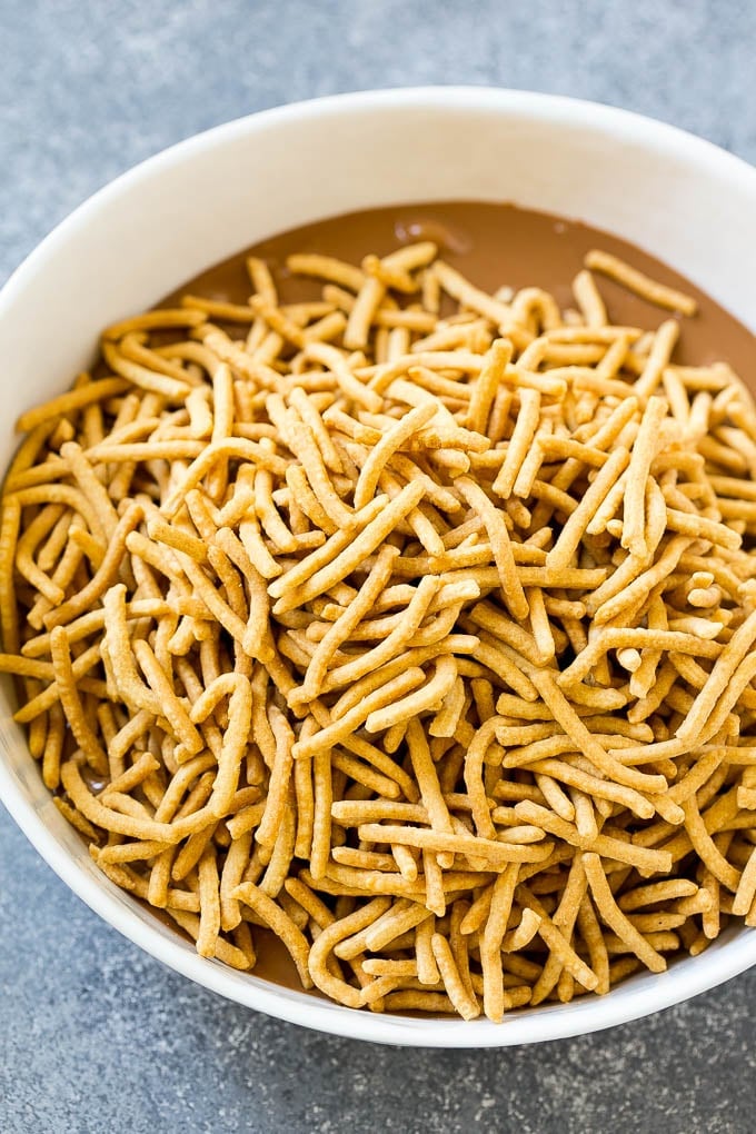 Haystack Cookies Recipe | No Bake Cookies | Chow Mein Noodle Cookies #nobakecookies #cookies #recipe #chocolate #ezlod A bowl of melted chocolate and chow mein noodles.