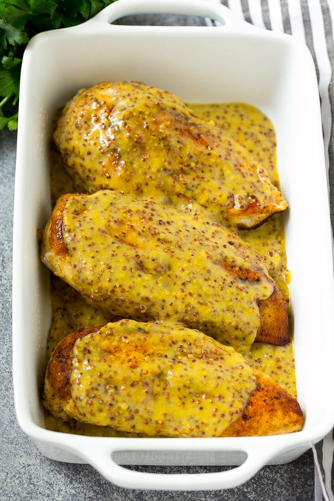 Honey Mustard Chicken Recipe | Baked Chicken Recipe | Easy Chicken Recipe #chicken #dinner #ezlod Chicken breasts in a baking dish topped with sauce.