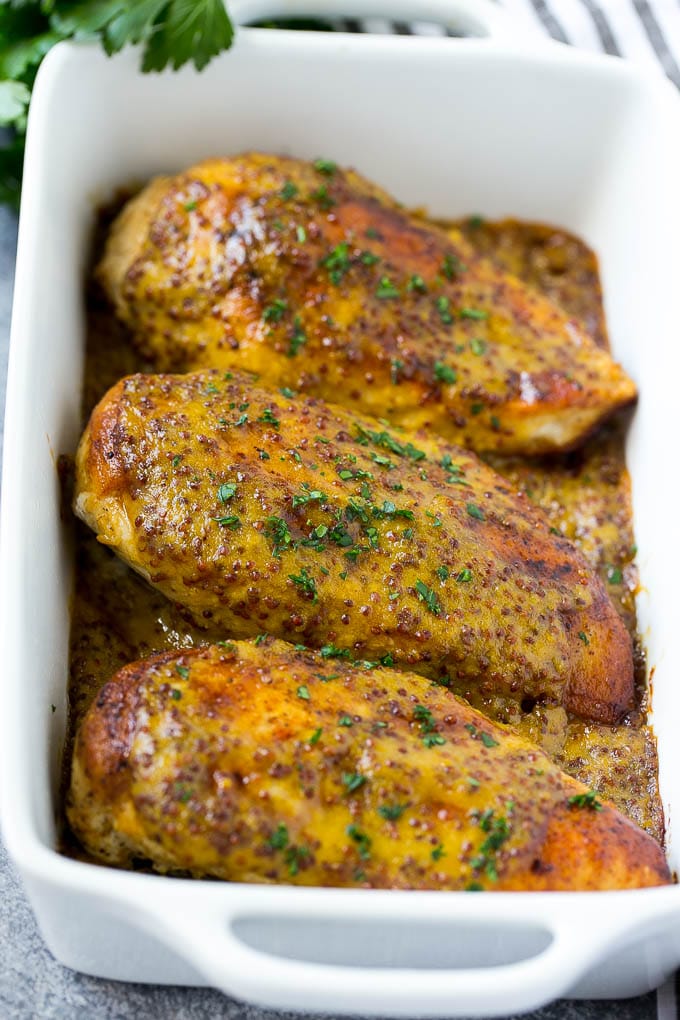Honey Mustard Chicken Recipe | Baked Chicken Recipe | Easy Chicken Recipe #chicken #dinner #ezlod Baked honey mustard chicken garnished with chopped parsley.