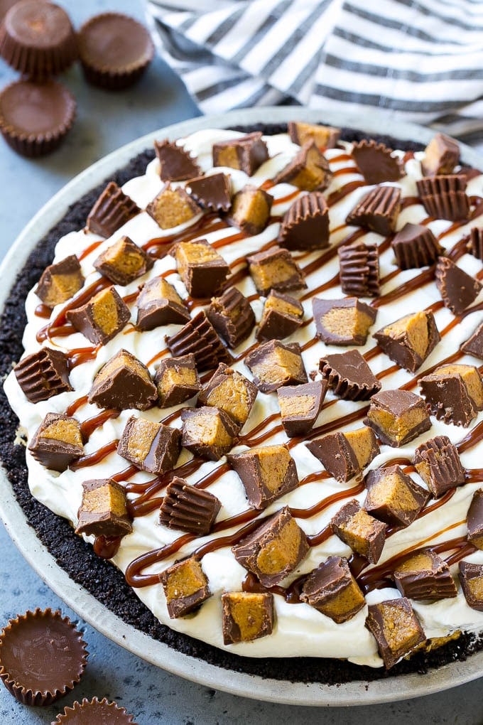 Chocolate Peanut Butter Pie Recipe | Peanut Butter Cup Pie | Peanut Butter Pie | No Bake Pie #chocolate #peanutbutter #pie #nobake #dessert #ezlod A peanut butter pie with cookie crust, peanut butter filling, whipped cream topping and chopped peanut butter cups.