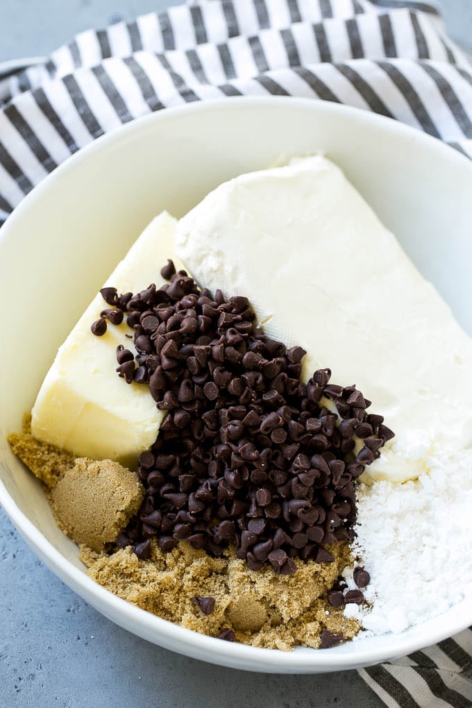 Cookie Dough Dip Recipe | Edible Cookie Dough | Chocolate Chip Cookie Dip #cookies #dip #cookiedough #dessert #snack #ezlod Ingredients including butter, cream cheese, chocolate chips and brown sugar.