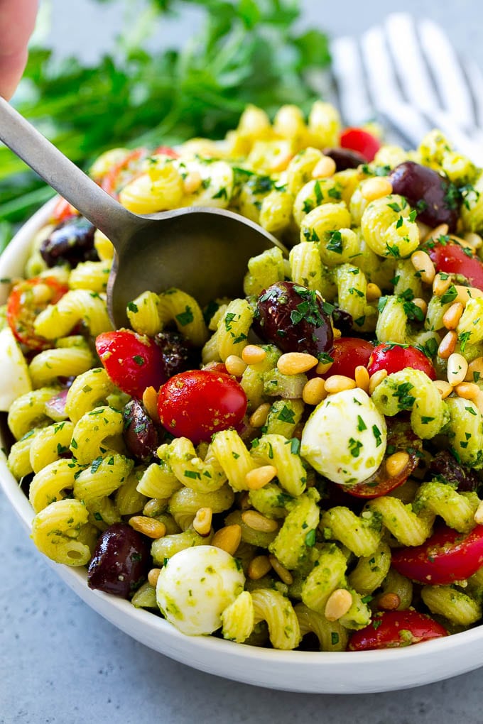 Pesto Pasta Salad | Italian Pasta Salad | Easy Pasta Salad #pasta #salad #pesto #olives #tomatoes #ezlod Pesto pasta salad with cherry tomatoes, olives, mozzarella balls, pine nuts and red onion.