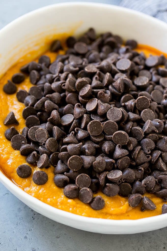 Pumpkin Chocolate Chip Cookies Recipe | Pumpkin Cookies | Pumpkin Chocolate Cookies #pumpkin #cookies #chocolate #baking #fall #ezlod #dessert Batter with chocolate chips on top in a bowl.