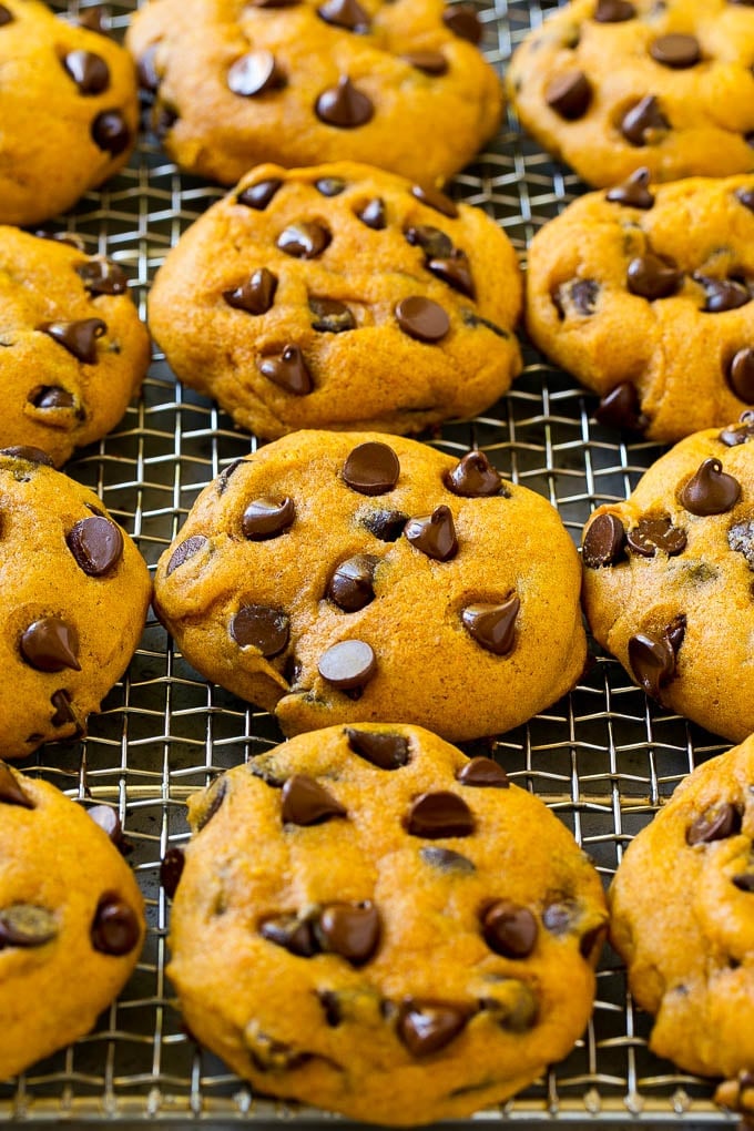 Pumpkin Chocolate Chip Cookies Recipe | Pumpkin Cookies | Pumpkin Chocolate Cookies #pumpkin #cookies #chocolate #baking #fall #ezlod #dessert Pumpkin chocolate chip cookies on a cooling rack.