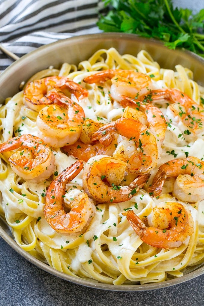 Shrimp Alfredo Recipe | Shrimp Alfredo Pasta | Shrimp Fettuccine Alfredo #shrimp #pasta #italianfood #ezlod A pan of shrimp alfredo with fettuccine, creamy parmesan sauce and garlic butter shrimp.