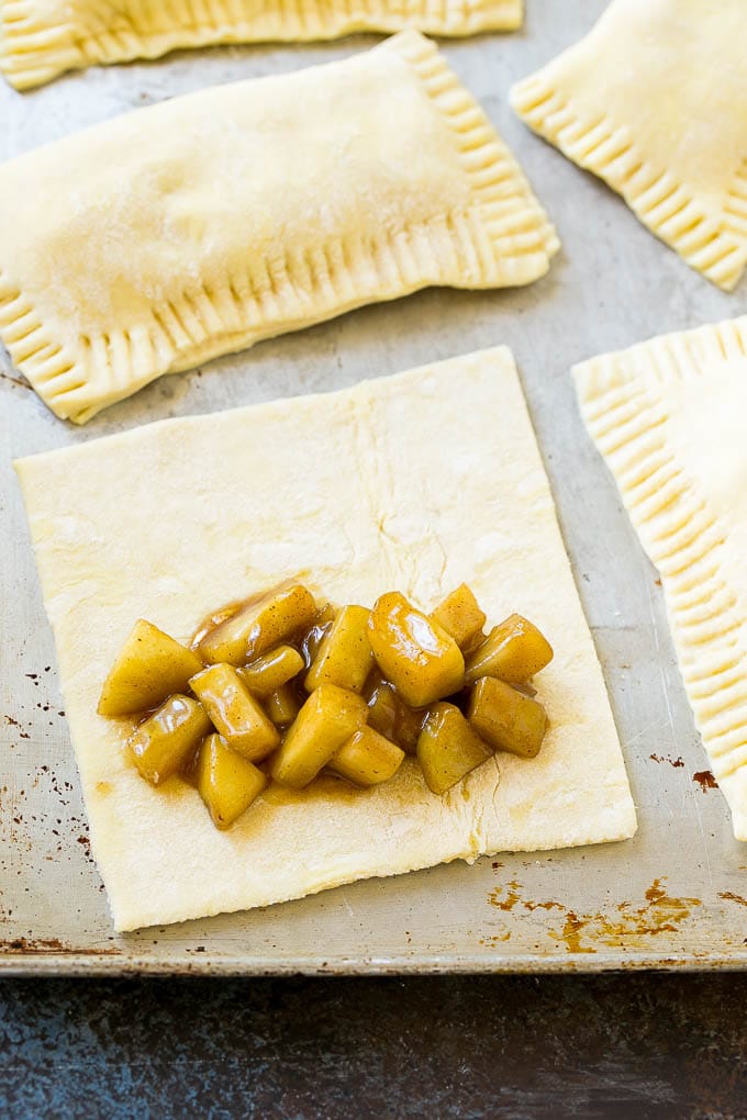Fried Apple Pies Recipe | McDonald's Copycat Recipe | Apple Pie | Apple Hand Pies #pie #apples #applepie #dessert #snack #ezlod A sheet of puff pastry topped with homemade apple pie filling.