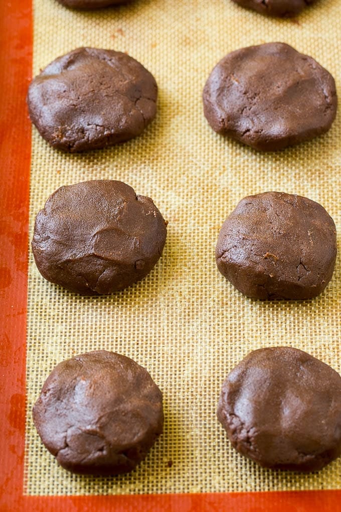 Nutella Cookies Recipe | Nutella Stuffed Cookies | Chocolate Cookies #nutella #chocolate #cookies #baking #dessert #ezlod Nutella cookie dough on a baking sheet.