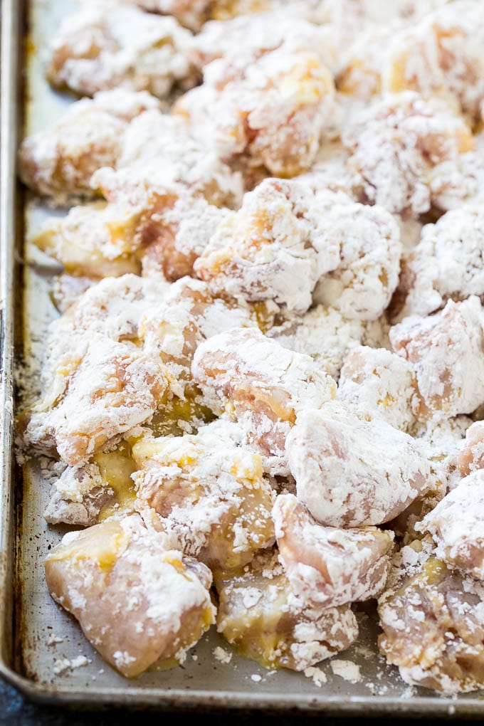 Orange Chicken Recipe | Chinese Orange Chicken | Panda Express Orange Chicken #orange #chicken #takeout #chinesefood #dinner #ezlod Chicken pieces coated in egg and flour.