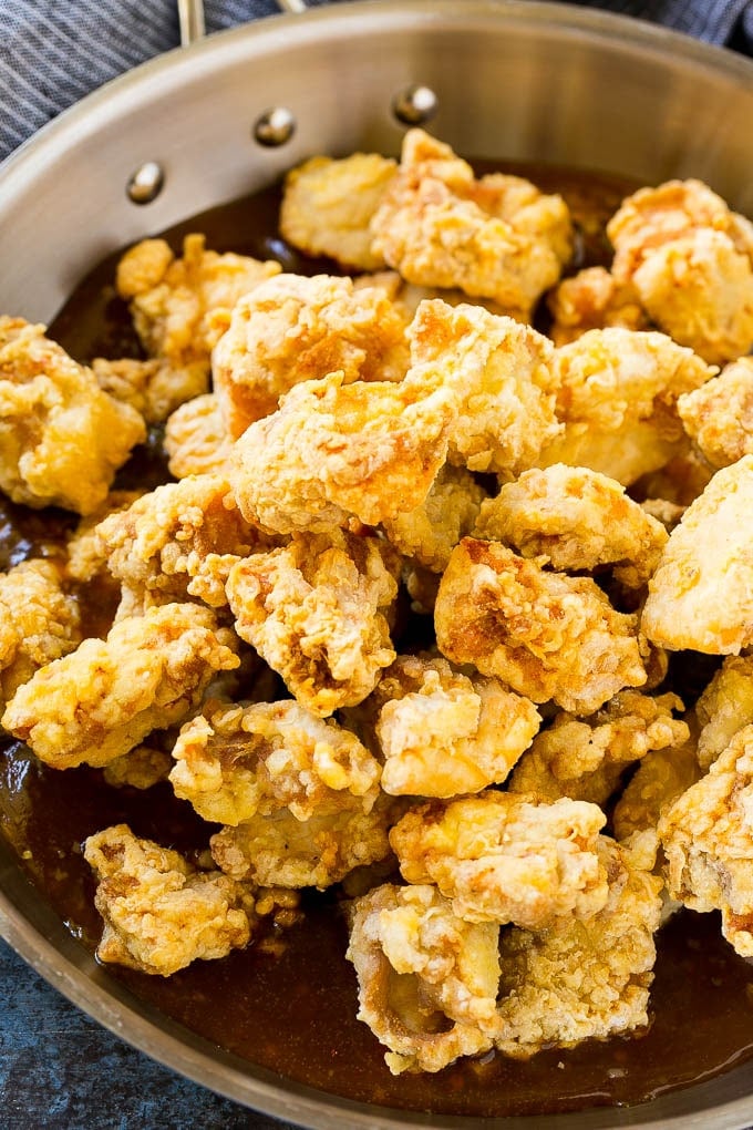 Orange Chicken Recipe | Chinese Orange Chicken | Panda Express Orange Chicken #orange #chicken #takeout #chinesefood #dinner #ezlod Crispy chicken pieces in a pan of orange sauce.