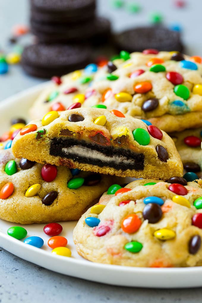 Oreo Stuffed Cookies Recipe | M&M's cookies | Stuffed Cookies #cookies #chocolate #oreos #dessert #baking #ezlod A plate of Oreo stuffed cookies topped with miniature M&M's.