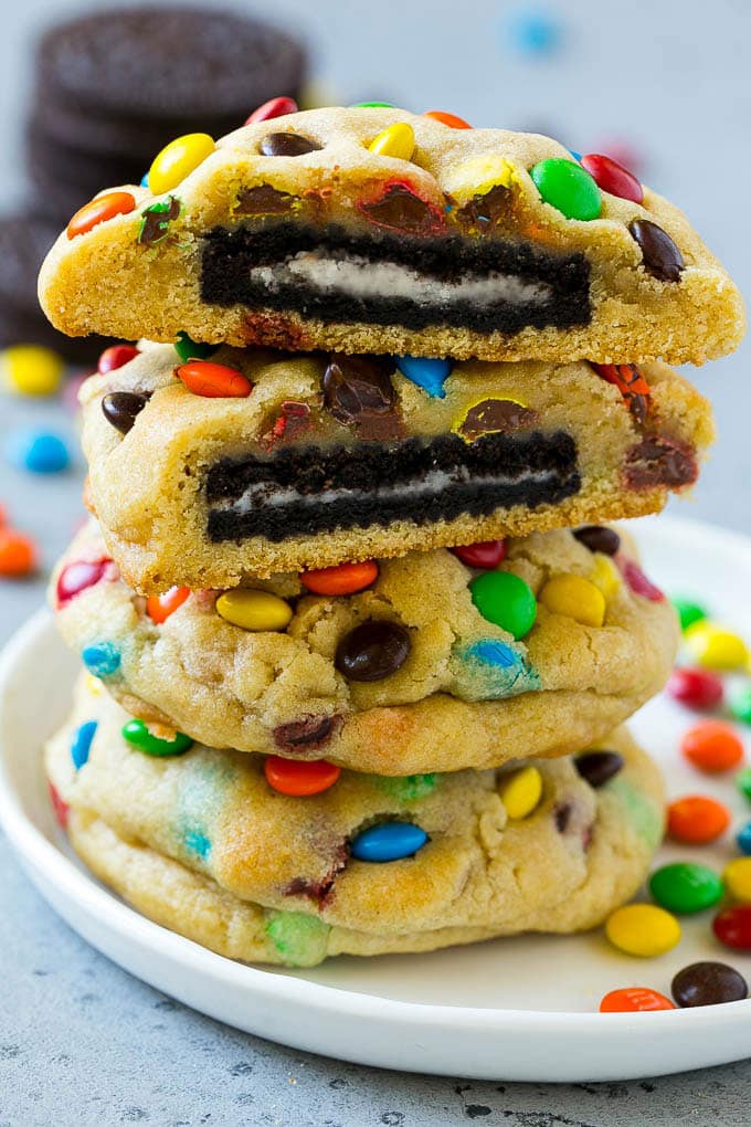 Oreo Stuffed Cookies Recipe | M&M's cookies | Stuffed Cookies #cookies #chocolate #oreos #dessert #baking #ezlod A stack of Oreo stuffed cookies on a plate.