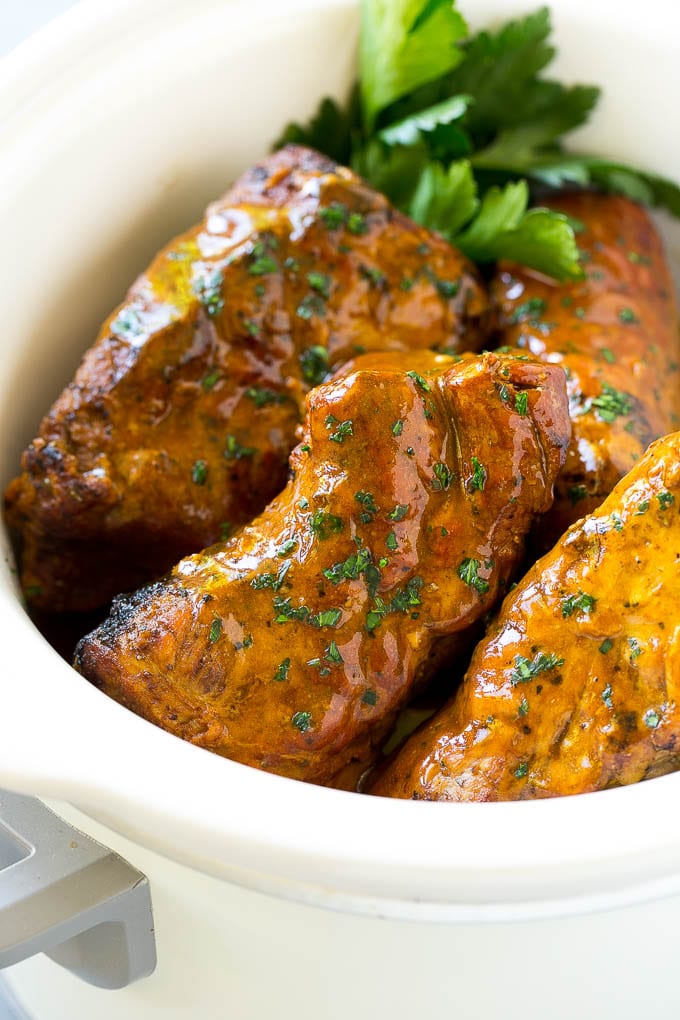 Slow Cooker Pork Tenderloin Recipe | Crock Pot Pork Tenderloin | Easy Pork Tenderloin #slowcooker #crockpot #pork #dinner #ezlod Slow cooker pork tenderloins coated with sauce, inside a crock pot.