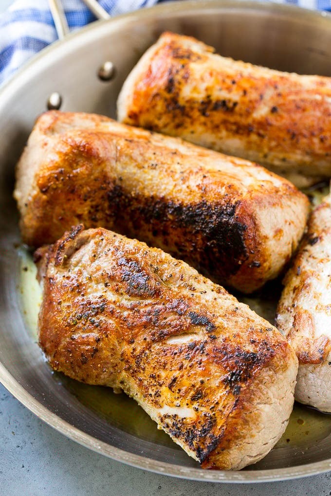 Slow Cooker Pork Tenderloin Recipe | Crock Pot Pork Tenderloin | Easy Pork Tenderloin #slowcooker #crockpot #pork #dinner #ezlod Seared pork tenderloin in a skillet.