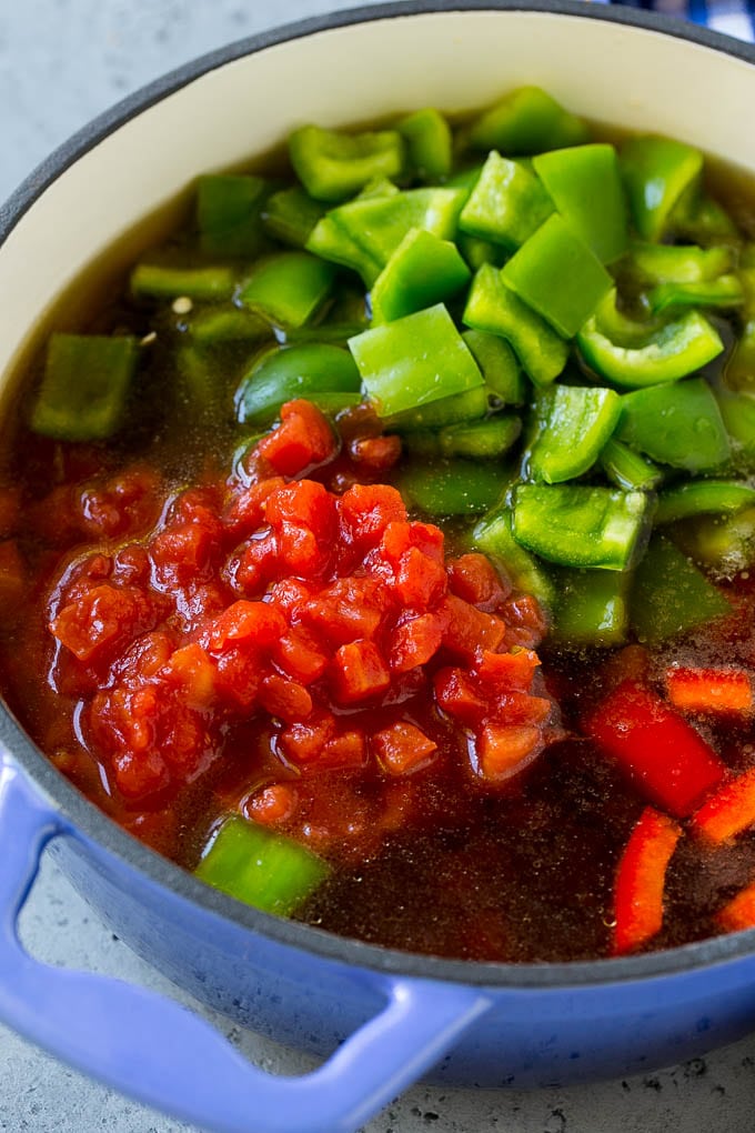 Stuffed Pepper Soup Recipe | Beef and Rice Soup | Stuffed Peppers #peppers #soup #beef #rice #dinner #ezlod Ground beef, tomatoes, peppers and beef broth in a pot.
