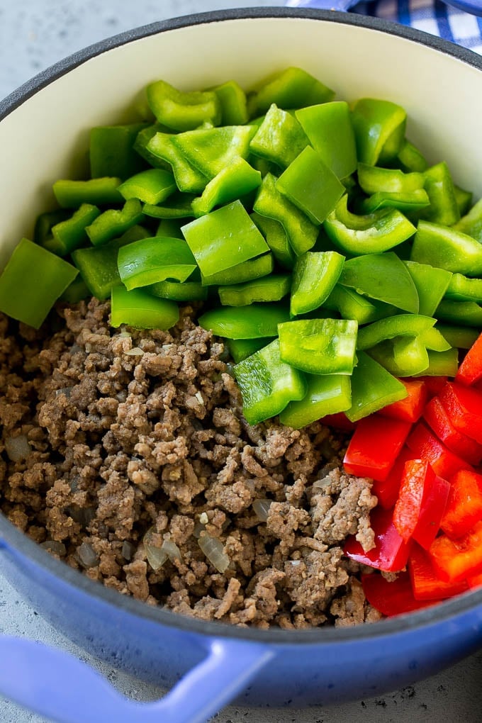 Stuffed Pepper Soup Recipe | Beef and Rice Soup | Stuffed Peppers #peppers #soup #beef #rice #dinner #ezlod Cooked ground beef and bell peppers in a soup pot.