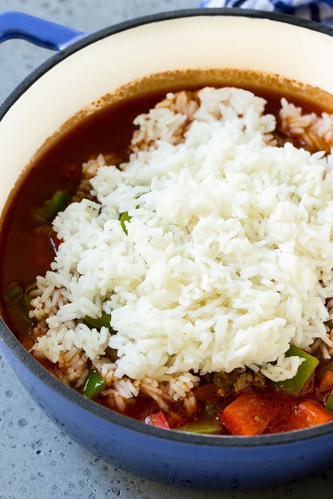 Stuffed Pepper Soup Recipe | Beef and Rice Soup | Stuffed Peppers #peppers #soup #beef #rice #dinner #ezlod Cooked rice being on top of soup.